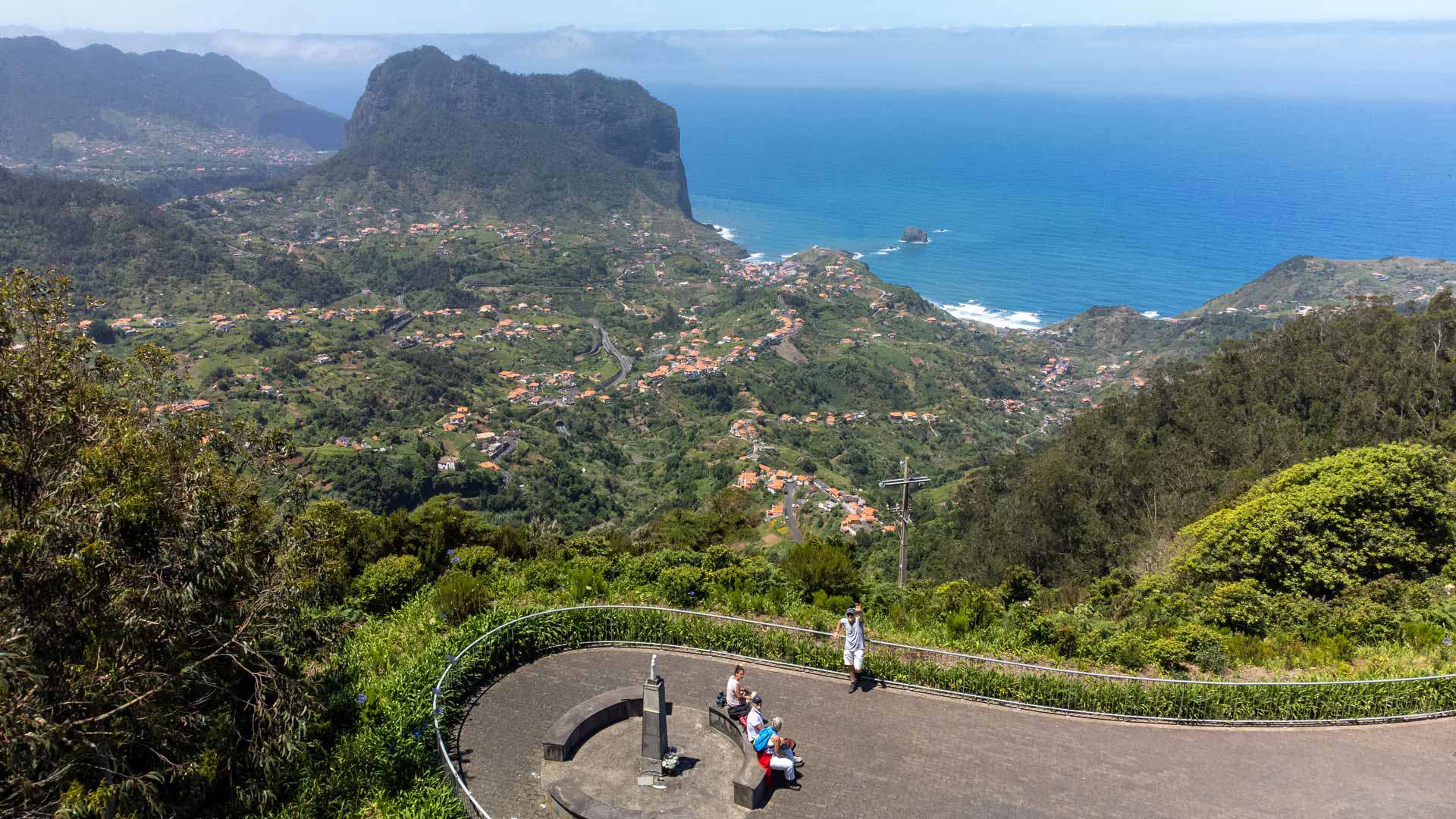 Terraced green valleys of Madeira with a winding mountain road